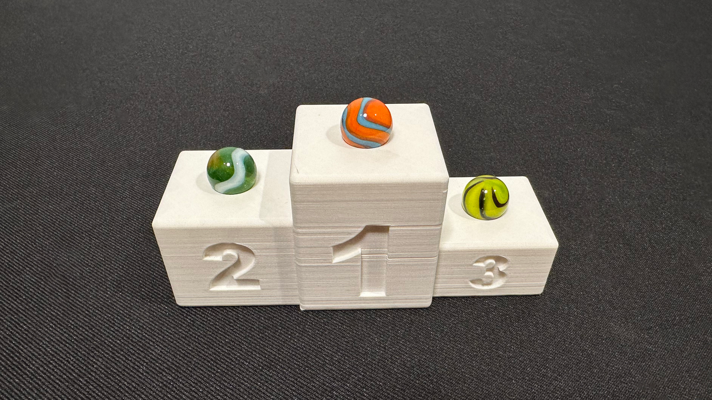 Finish podium: Proudly display your winning marbles!