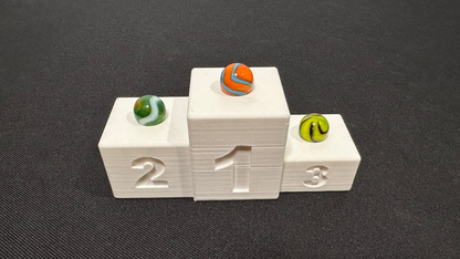 Finish podium: Proudly display your winning marbles!